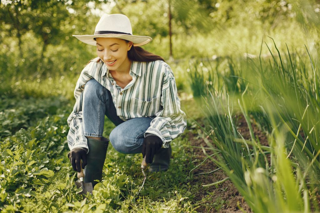 Girl gardening in summer | Barefoot Garden Design