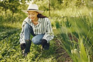 Girl gardening in summer | Barefoot Garden Design