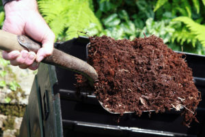 shovel with compost | Barefoot Garden Design